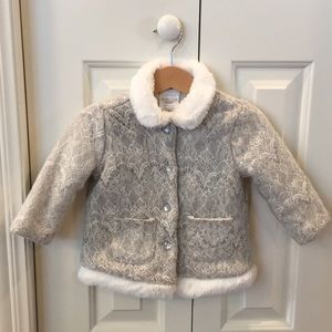 Lace and faux fur coat with rhinestone hearts.